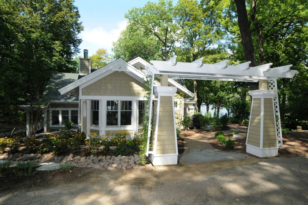 Lake Geneva home has custom trellis installed in garden Custom trellis constructed for home